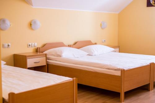Postel nebo postele na pokoji v ubytování Guesthouse Beno
