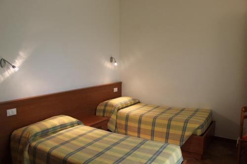 Postel nebo postele na pokoji v ubytování Al Castello