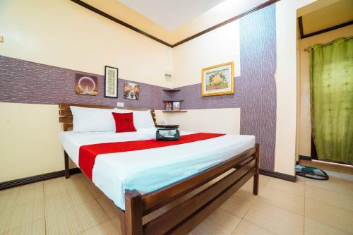 Postel nebo postele na pokoji v ubytování RedDoorz at Tagaytay Road