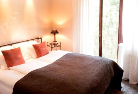 a bedroom with a bed and a window at Le Temple in NeuhÃ¼tten