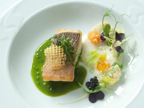 a plate of food with bread and vegetables on it at Le Temple in NeuhÃ¼tten