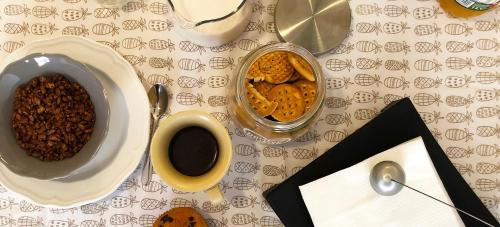 a table with a bowl of food and a cup of coffee at ApartmentsPadova in Padova