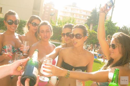 a group of women in bathing suits holding wine glasses at Now Benidorm in Benidorm