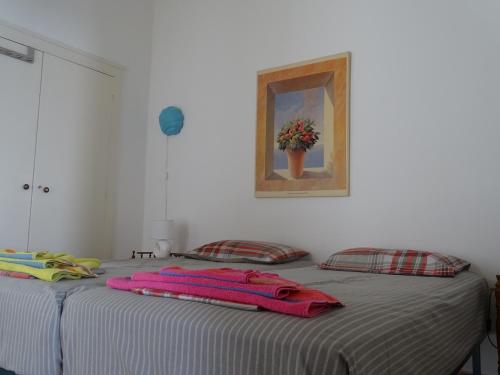 a bedroom with two beds with towels on them at Alexandros House in Apollonia