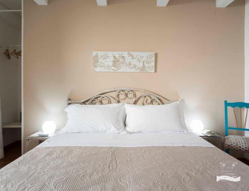 Postel nebo postele na pokoji v ubytování Palazzo Carrano Vietri sul Mare