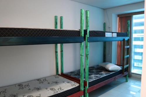 a group of bunk beds in a room at Hostel 33 Brazil in Guarulhos