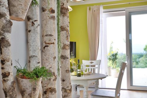 a dining room with a table and a window at Landvilla Pia in Attendorf