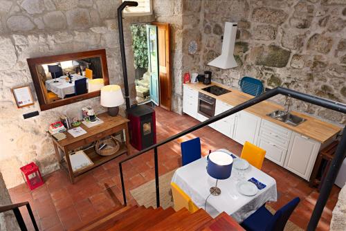 a kitchen and dining room with a table and chairs at Manor House Porto in Porto