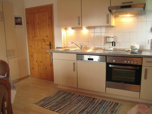 a kitchen with a sink and a stove top oven at Apartment in Langewiese Sauerland with garden in Winterberg