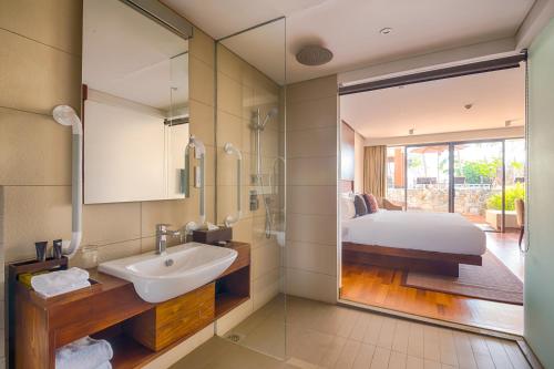 a bathroom with a double sink and a large mirror at Le Grand Galle By Asia Leisure in Galle