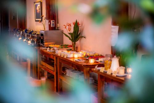 a buffet line with food in a restaurant at La Casa Resort in Phú Quốc