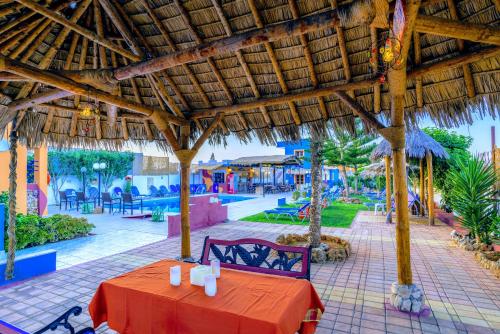 a table with a red table cloth in a resort at Eltina Apartments in Malia