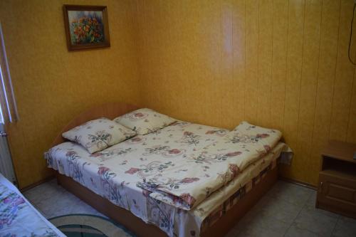 a small bedroom with a bed in a room at Constancia in Kamianets-Podilskyi
