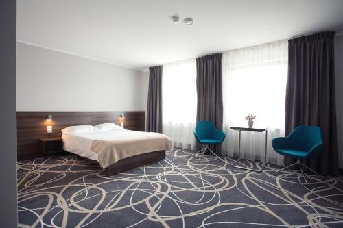 Posteľ alebo postele v izbe v ubytovaní Hotel Nad Nettą