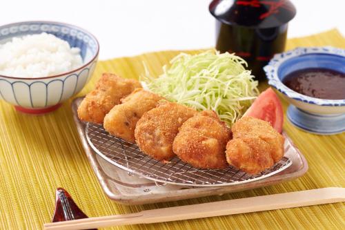a plate of food with onion rings and a bowl of rice at Hotobil B&B 潤 An inn that enjoys breakfast in Nara