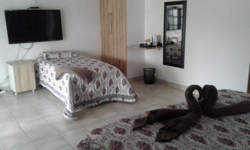 מיטה או מיטות בחדר ב-Elegant Guest House Malelane