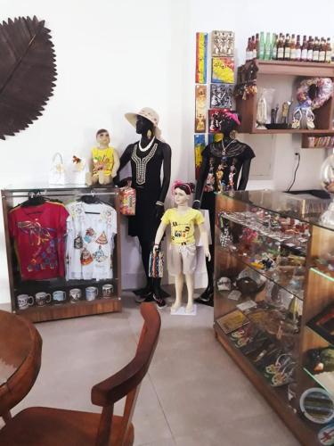 a room with two mannequins in a store at Hotel Sempre Executive in Salvador