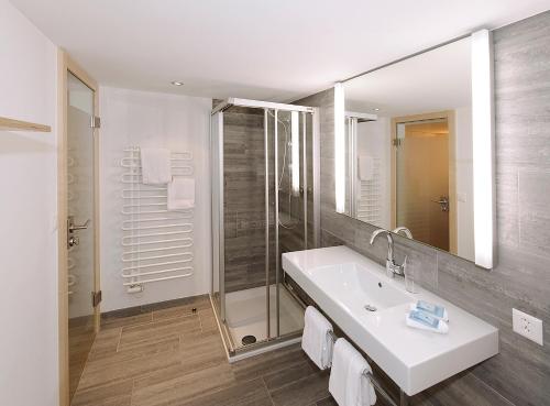 Ванная комната в Alpinhotel Bort