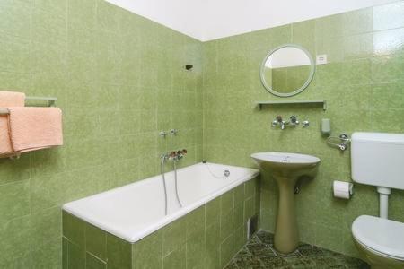 a bathroom with a sink and a tub and a toilet at Beach Apartment Viktor 2 in Postira