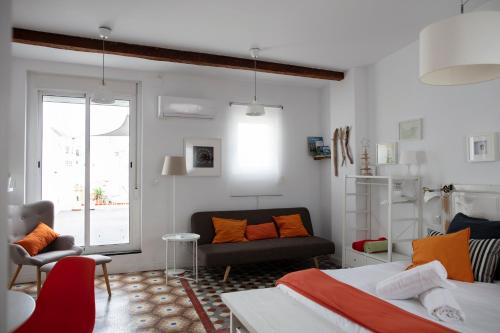 En eller flere senger på et rom på FLORIT FLATS - Ático Oasis de Ruzafa