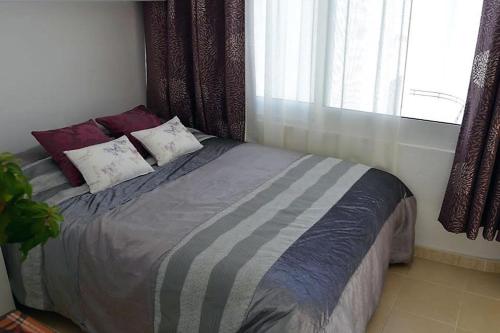 A bed or beds in a room at Apartamento Estepona Golf