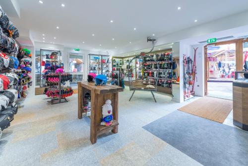 a store filled with lots of different types of shoes at Hotel La Chaudanne in Méribel