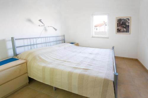 Postel nebo postele na pokoji v ubytování Apartments Kala mendula