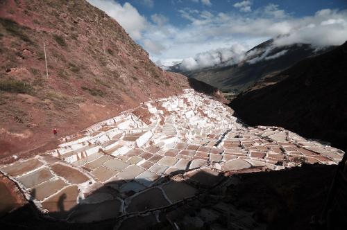 an aerial view of a mountain side with a village on it at Kiswar Lodg in Ollantaytambo
