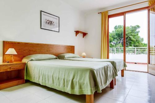 Postel nebo postele na pokoji v ubytování Villa Pou Uno