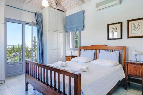 Ένα ή περισσότερα κρεβάτια σε δωμάτιο στο Villa Votsalo