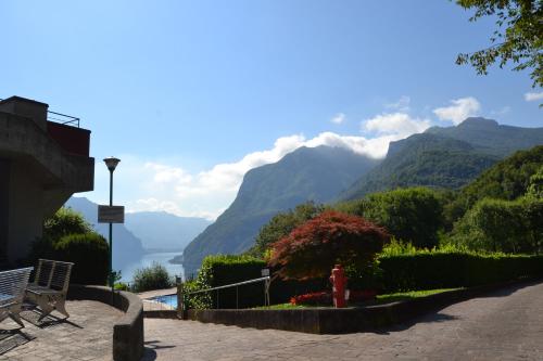 a view of a valley with mountains and a fire hydrant at Appartamenti Lago di Como in Valbrona
