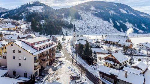 an aerial view of a town with snow covered buildings at Quercus Appartements contactless check-in in Patergassen