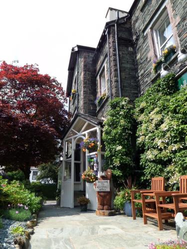 a house with a sign in front of it at Allerdale Guest House in Keswick