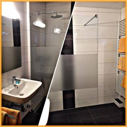 a bathroom with a sink and a shower at Das Gästehaus Eimeldingen in Eimeldingen