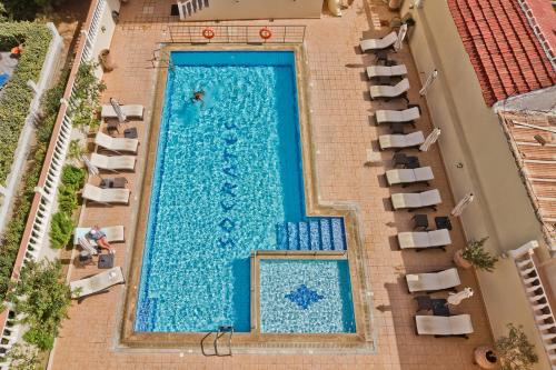 an overhead view of a swimming pool in a hotel at Socrates Studios & Apartments in Karpathos Town