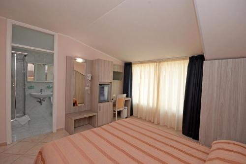 Postelja oz. postelje v sobi nastanitve Hotel Concorde