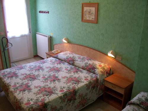 En eller flere senge i et værelse på Hotel Vecchia Rimini