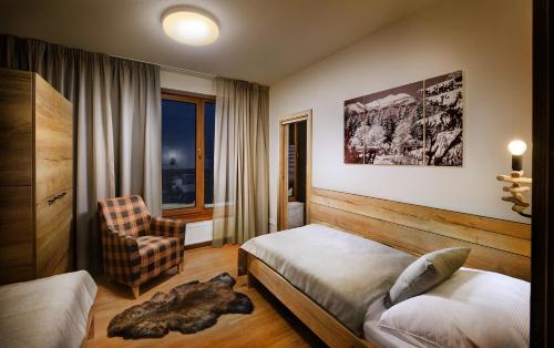 Katil atau katil-katil dalam bilik di Chalets Minerália
