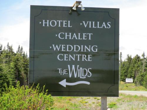 a sign for a hotel villas cheetah wedding centre the winds at The Wilds at Salmonier River in Holyrood
