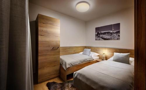 Katil atau katil-katil dalam bilik di Chalets Minerália
