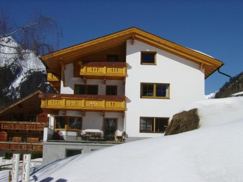 a building on a snow covered hill with at Haus Birkenheim in Sölden