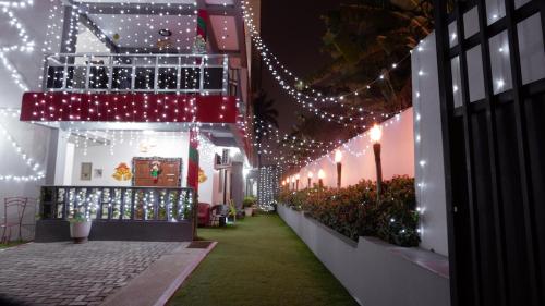 a walkway with christmas lights in a building at Van Der Salle in Accra