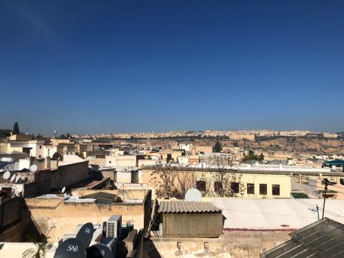 a view of a city with buildings at Le Grand Alcazar - Riad in Fès