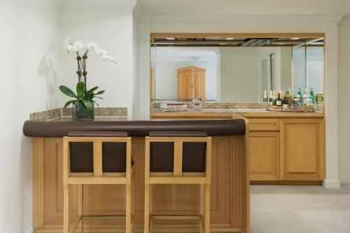 a bathroom with a bar with a mirror at The Michelangelo Hotel in New York