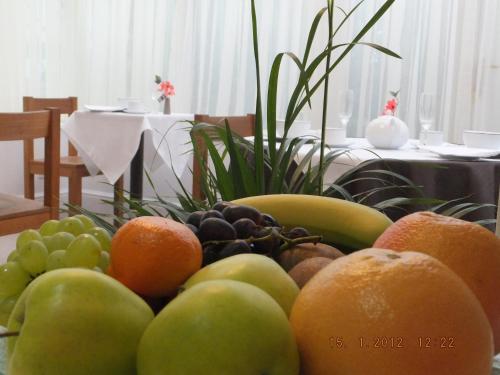 a pile of fruit sitting on a table at Jessamine House Hotel in Gravesend