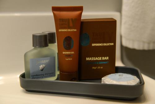 a tray of products sitting on a bathroom counter at Bar-B Inn in Assiniboia