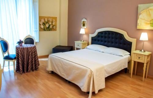 Posteľ alebo postele v izbe v ubytovaní La Collegiata Guest House
