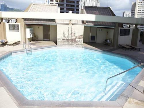 a large swimming pool on top of a building at Waikiki Timeshare 77 in Honolulu