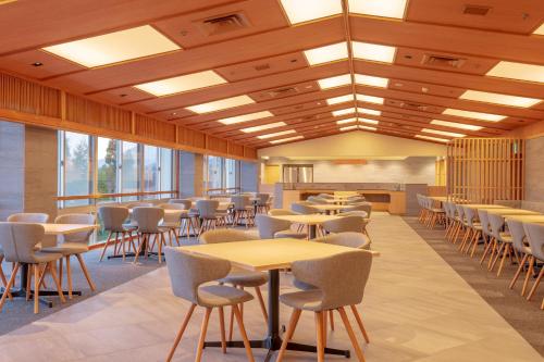 a classroom with tables and chairs in a building at Lime Resort Myoko in Myoko