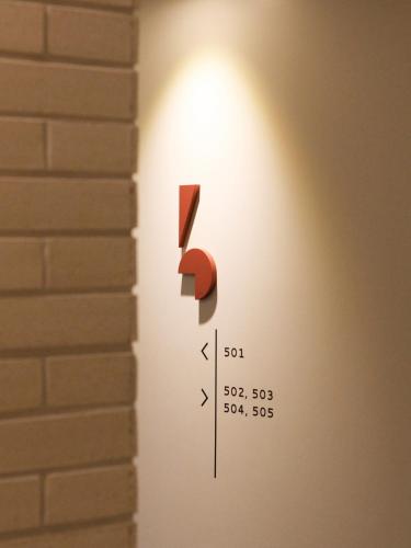 a wall light with a number one on it at Tong Tong Petit Hotel in Seoul